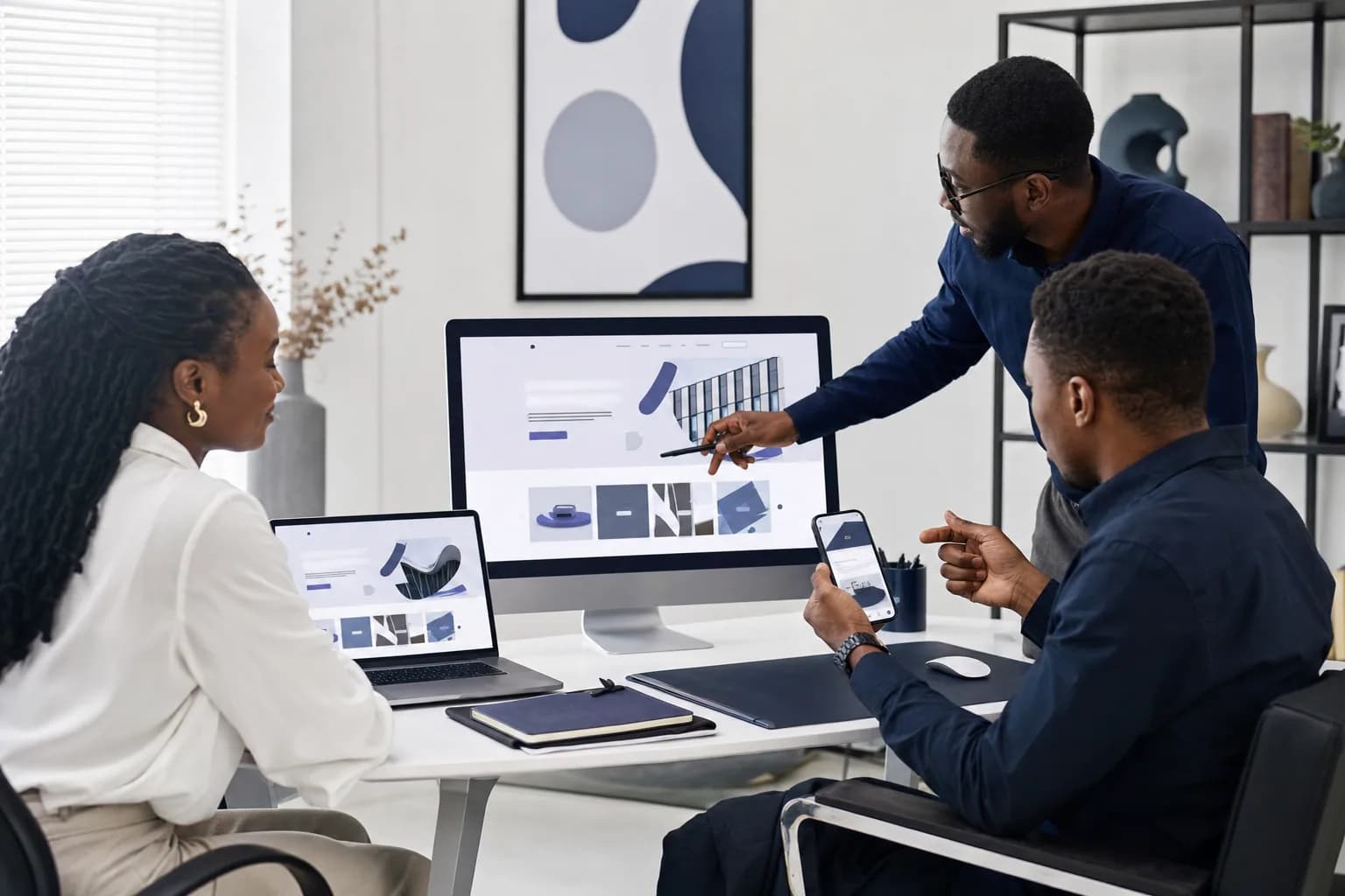 Creative team reviewing digital campaign destinations across devices